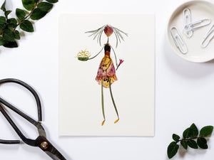 The BON APPETIT CARD by PETAL PEOPLE PRESS features a whimsical illustration of a slender figure adorned with long hair-like strands and dressed in a decorated attire. The figure delicately holds a small plant-like object, reminiscent of pressed flower art. This colorful and imaginative design stands out beautifully against the white background, making it an ideal choice for a botanical notecard.