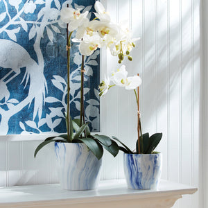 The NAPA HOME AND GARDEN Barclay Butera Marbleized Pot Large boasts a white and blue marbled pattern, with the larger pot elegantly placed behind the smaller one. These pots infuse modern artistry into any interior design palette.