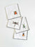 Four EMBROIDERED INSECT COASTERS from DOT AND ARMY are displayed in a 2x2 grid on a light surface. Each coaster, crafted in Georgia, features colorful embroidered insects: a red and black ladybug in the top left, an orange and black beetle in the top right, a green dragonfly in the bottom left, and a green bug in the bottom right.