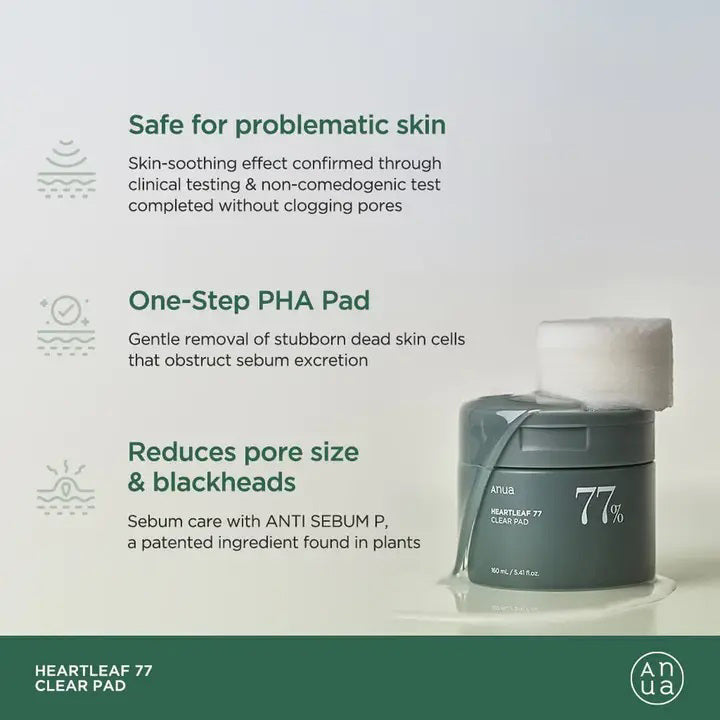 A green cylindrical container with a lid, labeled &quot;ANUA HEARTLEAF 77% CLEAR PAD&quot; in white text is featured. From KOSMIC KBEAUTY SKINCARE, it contains 160ml of heartleaf extract, renowned for anti-inflammatory benefits and minimizing pore size. Set against a plain white background.