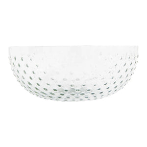 The CREATIVE COOP RECYCLED GLASS HOBNAIL LOW BOWL features a textured, dimpled surface with a scalloped edge. This elegant serveware piece is made from transparent recycled glass and offers a simple design.