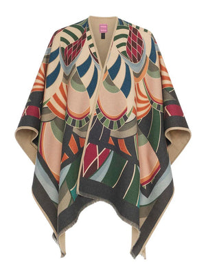 The FRANCO FERRARI PSYCHEDELIC PRINT WOOL PONCHO is displayed against a white background. This vibrant poncho features an abstract, psychedelic print with various geometric shapes and shades of green, orange, red, blue, and beige. Made in Italy by FRANCO FERRARI, it boasts an open front and a fringed hem.