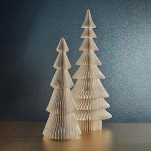 The WISH PAPER DECORATIVE TREE - APLINA 36IN by ZODAX is a stylish paper ornament styled like a Christmas tree, featuring layered, conical sections folded in a zigzag pattern. This beige ornament stands upright against a white background, adding charm to any setting. Its compact size makes it an ideal choice for small spaces, enhancing the versatility of your decor.