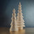 The ZODAX WISH PAPER DECORATIVE TREE - DAVOS 48IN is an elegant paper Christmas tree with an accordion-style design, showcasing multiple layers of folded beige paper. Standing against a plain white background, its dimensions are 20 inches by 48 inches, making it a striking addition to your festive decor.