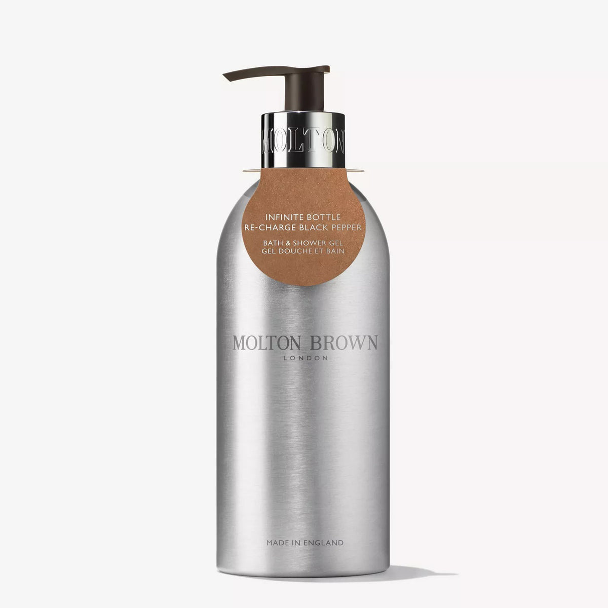 A silver MOLTON BROWN RE-CHARGE BLACK PEPPER BATH AND SHOWER GEL INFINITE BOTTLE with a pump and brown label, featuring a bold black pepper scent, shown against a white background.