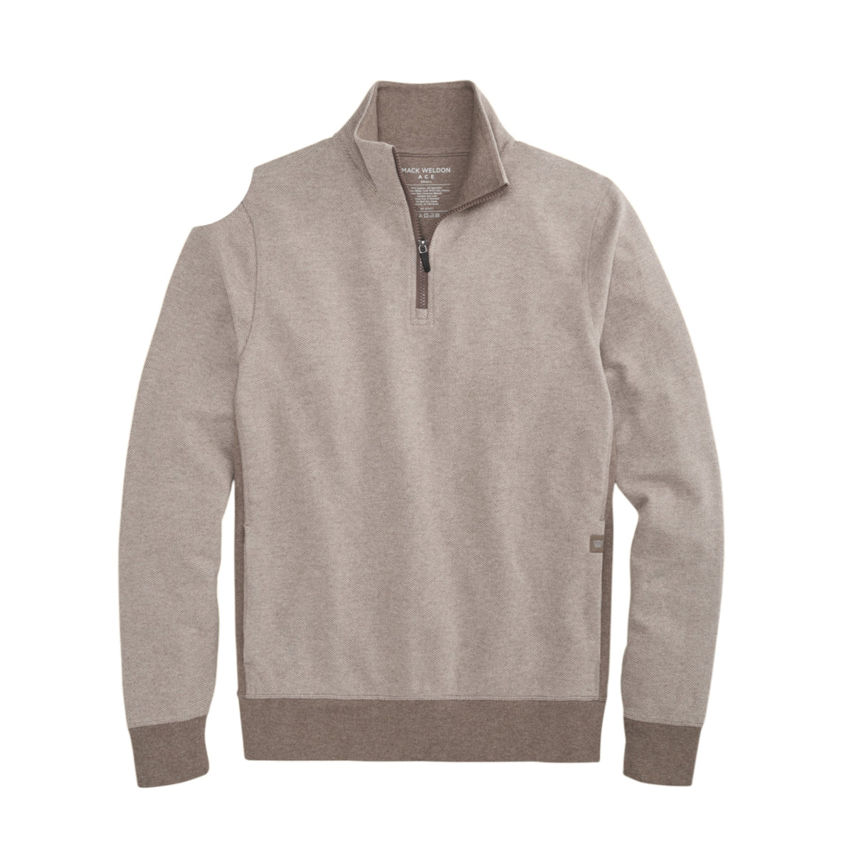 A man with short light brown hair stands in profile, wearing the MACK WELDON Ace 1/2 Zip Sweater in Herringbone and dark pants, one hand in his pocket, against a plain light gray background.