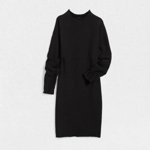 The FRANK & EILEEN - IZZIE SWEATSHIRT PARTY DRESS, crafted from 100% cotton, is laid flat against a white textured background. This simple black dress showcases long sleeves, a crew neckline, and a straight silhouette extending to knee-length.