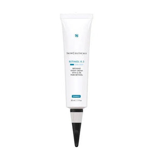 A white tube of SKINCEUTICALS - RETINOL .03 night cream, a premier Retinol face cream from SkinCeuticals designed for acne treatment and anti-aging, containing pure retinol, 30 ml. The tube features a black cap and displays blue and black text.