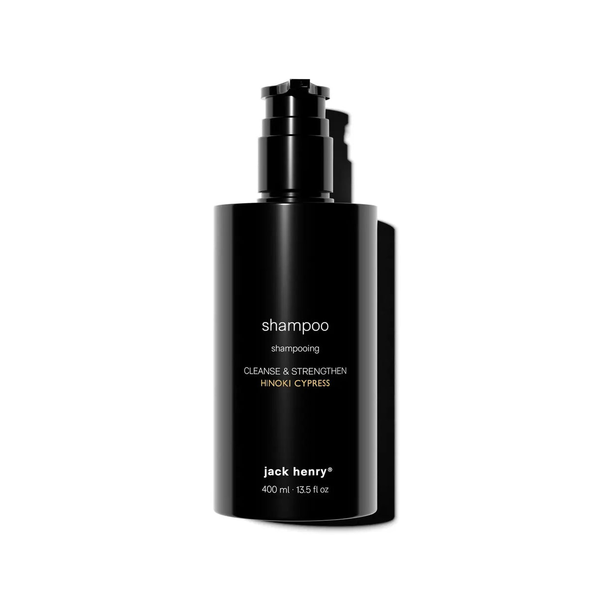 A sleek black pump bottle labeled &quot;JACK HENRY - CREAMY SHAMPOO&quot; with JACK HENRY branding holds 400 ml of keratin-infused formula, displayed against a white background.