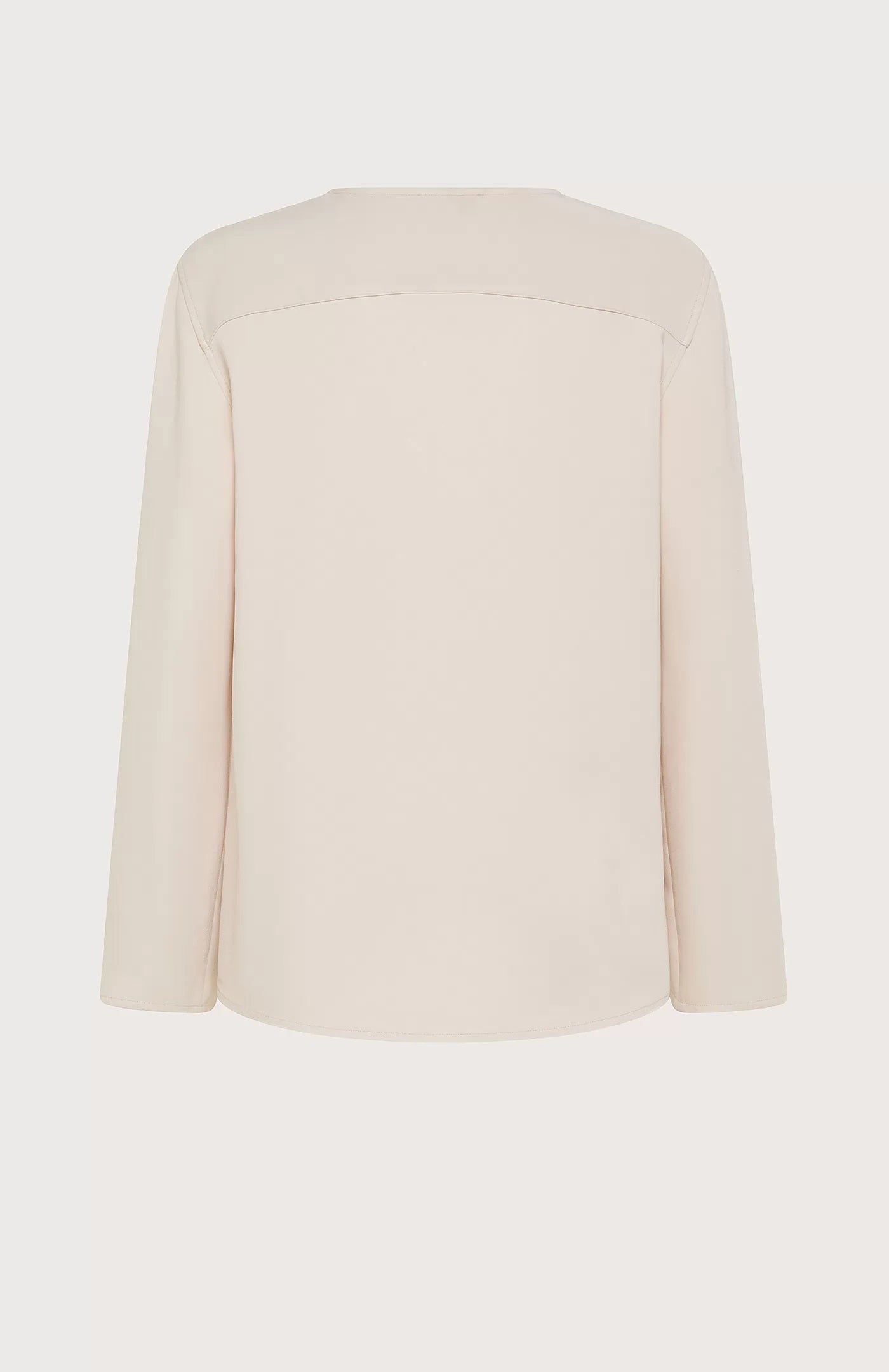 The SEVENTY Stretch Crewneck Viscose Top with Sleeve Detail is a light beige, long-sleeve shirt featuring a simple and elegant design. Made in Italy, this sophisticated top has slightly flared sleeves with subtle slits near the cuffs and a relaxed fit. Crafted from stretch viscose cady, it hangs straight for a minimalistic and refined appearance.