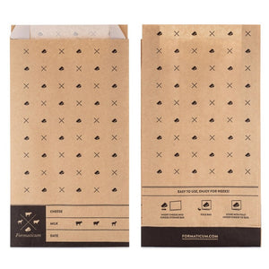 The Formaticum product packaging box for cheese storage bags is perfect for keeping cheese fresh at home. The box has a mainly white design with black accents and text, displaying icons of various cheese shapes. The text reads "FORMATICUM - CHEESE STORAGE BAGS" and indicates that it contains 15 bags.