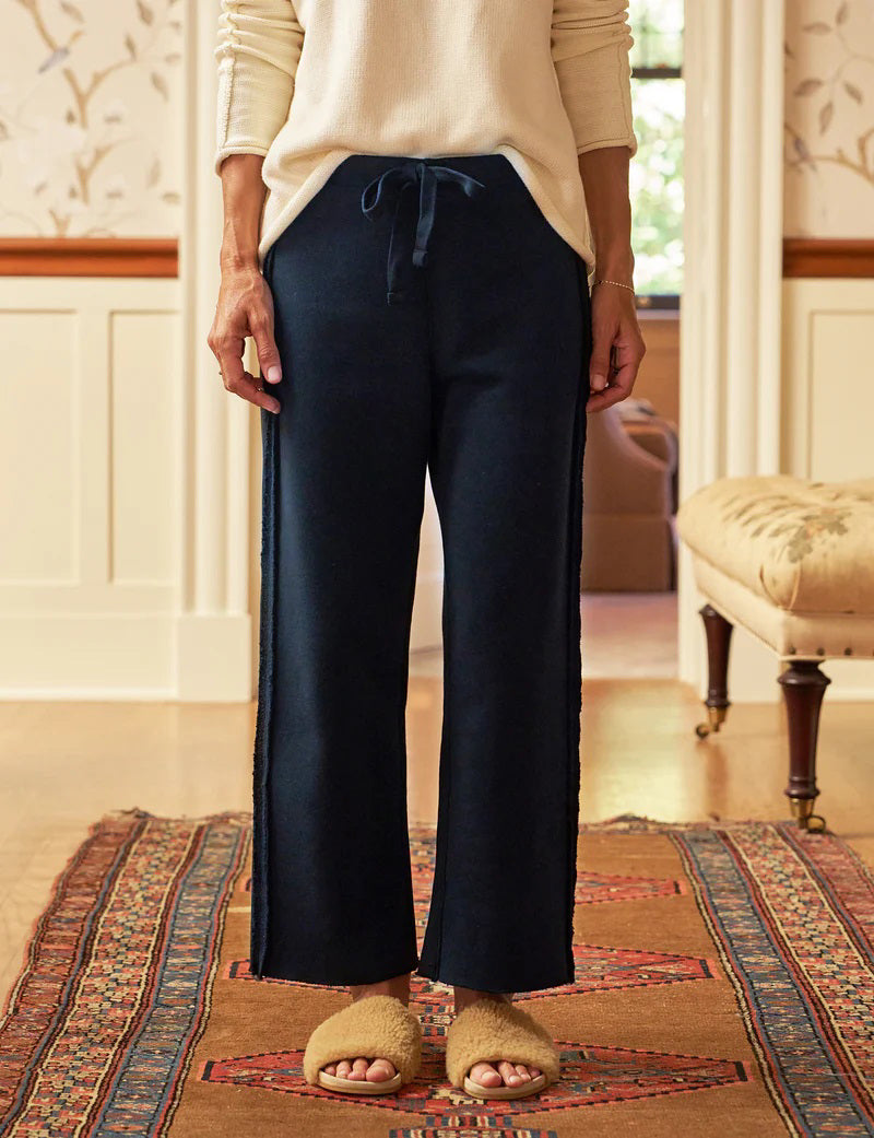 The FRANK &amp; EILEEN BELLA ITALIAN SWEATPANT is a light beige, wide-leg knit pant with a drawstring waist and subtle side trim, shown flat on a white background.