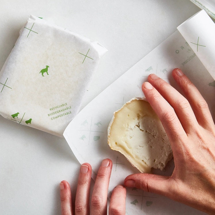 A rectangular, brown package of FORMATICUM - ZERO CHEESE STORAGE PAPER from the brand FORMATICUM. The packaging promotes it as compostable, biodegradable, and recyclable. The text includes "Zero," "15 sheets," and "keeps cheese fresher, longer" alongside small icons of cheese and animals.