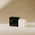 A white conditioner bar rests next to its black packaging on a beige background. The packaging displays "PRESTON," "Softening Argan Oil Conditioner Bar with Indian Amla Oil," "Amber," and "Made in USA," along with the weight "2.5 OZ" and "71 G." This plastic-free PRESTON - CONDITIONER BAR nourishes hair for a softer feel.