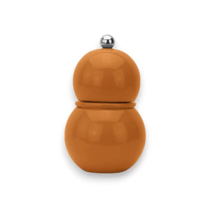 The ADDISON ROSS LONDON - CHUBBIE SALT OR PEPPER MILL 12CM is a small, round, orange grinder with a sleek and glossy finish. It features a bulbous shape divided into two segments, topped with a silver knob and equipped with a ceramic mechanism inside for precise grinding.