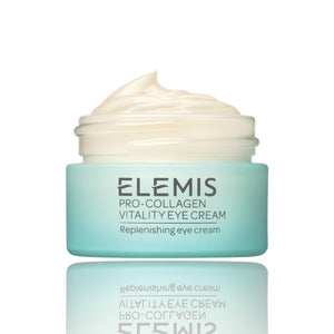 Close-up view of smooth, creamy, light beige substance spread in swirls, resembling the luxurious ELEMIS - PRO-COLLAGEN VITALITY EYE CREAM. The glossy surface showcases its rich and firming consistency, perfect for revitalizing delicate skin.