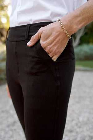 The FRANK & EILEEN - MURPHY BILLION DOLLAR PANT is laid flat against a white background. These black dress pants feature a straight-leg cut, with side pockets and a waistband adorned with belt loops. The fabric appears smooth and slightly stretchy, making them perfect for transitioning from the boardroom to cocktails.