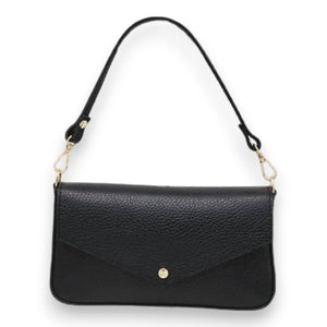 The LISA LIVI SMALL LEATHER SHOULDER BAG is a sleek and minimalist women's handbag made in Italy from genuine leather. It features a metallic silver finish with a textured surface, complemented by black straps and gold hardware. The front flap includes a stylish single-button closure.