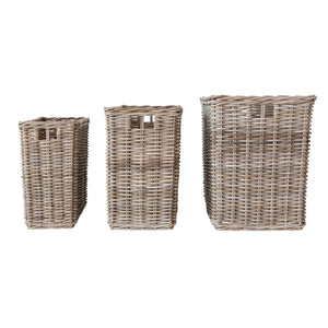 Three SMALL WOVEN WICKER RATTAN BASKETS WITH HANDLES from CREATIVE COOP of varying sizes are placed vertically in a straight line against a white background. Each basket features intricately woven rattan material and an open top.