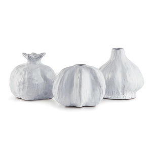 The NAPA HOME AND GARDEN - FERME GOURD VASE set includes three ceramic vases inspired by an organic pumpkin, pomegranate, and garlic bulb. Each features a white textured finish with unique contours and ridges, perfect for home decor.