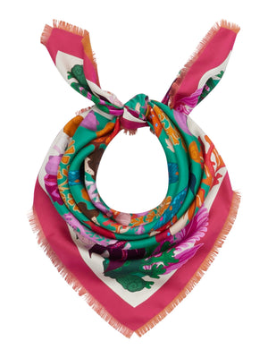 The FRANCO FERRARI - CIALDA DOUBLE SIDED FRINGE SILK SCARF 90CM, made of 100% silk, features a vibrant double-sided pattern in green, pink, orange, white, and brown hues. This colorful scarf can be folded into a triangle and tied at the top and is finished with fringed edges.