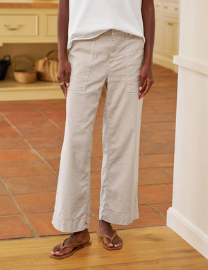 The FRANK & EILEEN Wexford Patch Pocket Wide Leg Pant in Cement is a light beige Italian Performance Linen trouser with front patch pockets, belt loops, and a high waist, shown laid flat on a white background.