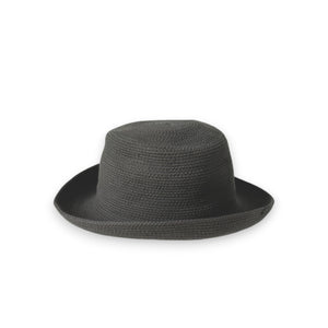 The BEACH HARE - WANDER HAT, a light-colored, wide-brimmed straw hat handmade by BEACH HARE in NYC, is showcased on a white background. It features a slightly curved brim and a simple woven pattern that exudes a casual and summery look. Additionally, it's packable for easy travel.