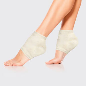 A pair of MOISTURIZING HEEL SOCKS by KITSCH in an off-white color with small, colorful speckles are laid out side by side on a gray background. These socks feature a ribbed cuff and are designed to fit over the ankle, ensuring a smooth feel for delicate skin.