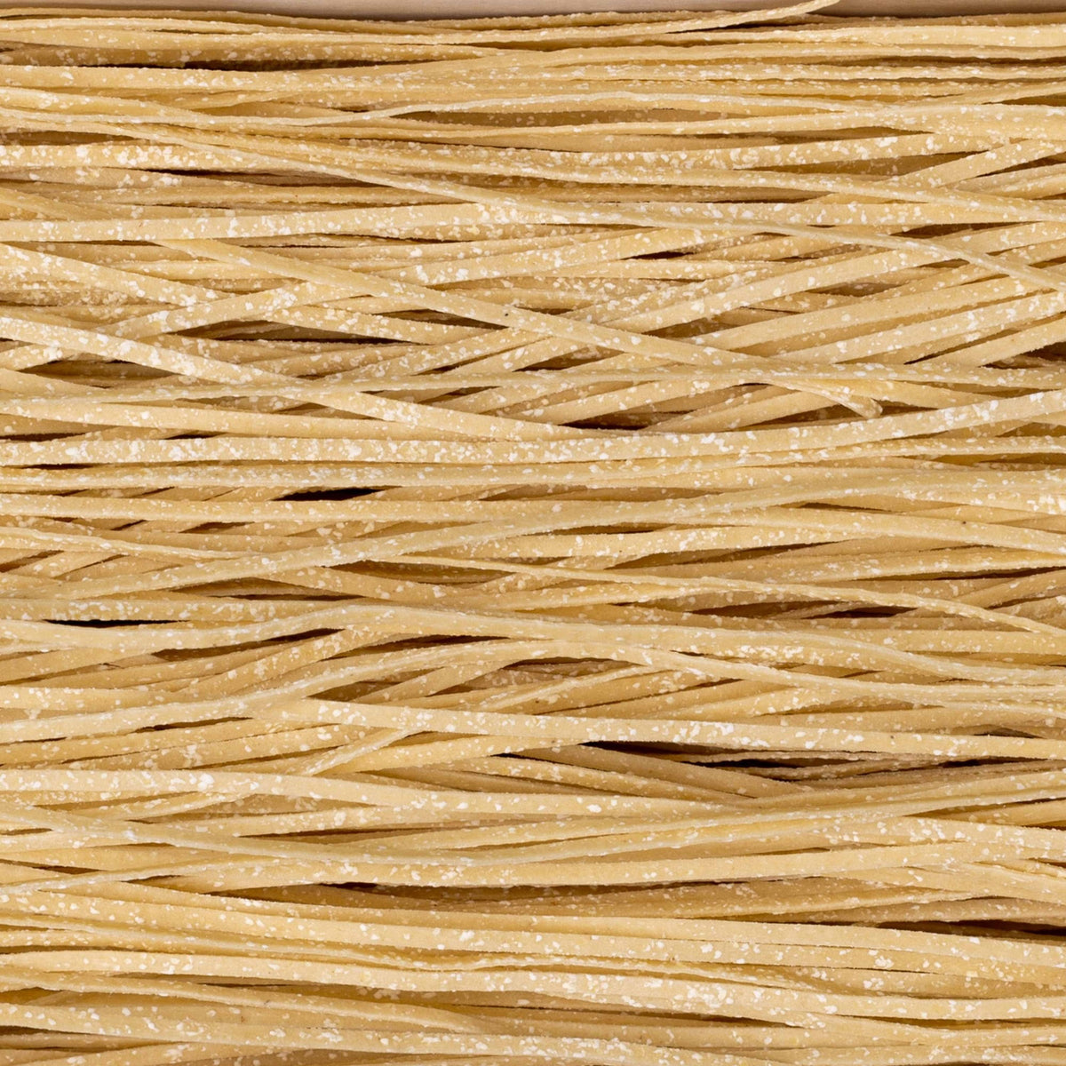 An Atalanta Corporation CIPRIANI - Organic 30% Protein Egg Tagliolini Pasta package. The black box with a turquoise stripe displays the label &quot;CIPRIANI - ORGANIC 30% PROTEIN EGG TAGLIOLINI&quot; and details such as &quot;30% Protein&quot; and &quot;380g.&quot; The pasta strands, made from Italian Durum Wheat Semolina, are visible through two transparent sections on the front.