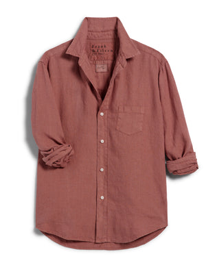 The FRANK & EILEEN Eileen Relaxed Button-Up Shirt in Mauve Washed Linen is a long-sleeved button-up shirt featuring a collar and a single chest pocket. The washed linen fabric provides a slightly textured appearance, with the sleeves casually rolled up for a laid-back style. This relaxed fit shirt is showcased against a plain white background.

