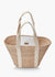 The KAYU Toci Medium Tote by KAYU features a wide, woven abaca straw body with sturdy cotton handles. Its minimalist design is highlighted by two vertical beige straps on both sides, combining style and functionality.