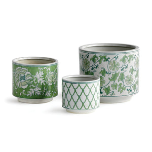 Explore the NAPA HOME AND GARDEN - IMPERIAL CYLINDER POT set of three ceramic planters, adorned with elegant green and white floral and geometric designs. The smallest has a diamond pattern, the medium a floral motif, and the largest a vine-like design. Available for in-store pickup.