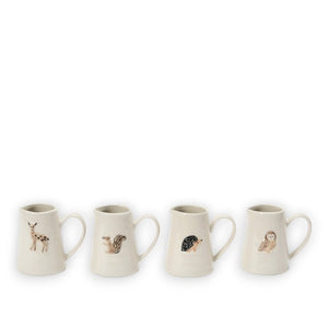 Set of four ceramic woodland animal creamers by Creative Coop, each featuring an embossed design of a deer, squirrel, hedgehog, and owl on a plain white background. Ideal for bringing a touch of rustic charm to your home decor.