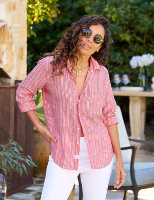 Introducing the FRANK AND EILEEN - EILEEN RELAXED BUTTON UP IN CLASSIC LINEN RED AND NAVY STRIPE. This button-up shirt features a red and navy striped pattern with long sleeves, rolled-up cuffs, and a collar. Crafted from classic linen for a lightweight and casual feel, it includes a pocket on the left chest and displays "Frank & Eileen EST 1947" inside at the collar. The design ensures bust-flattering button placement for that perfect relaxed fit.