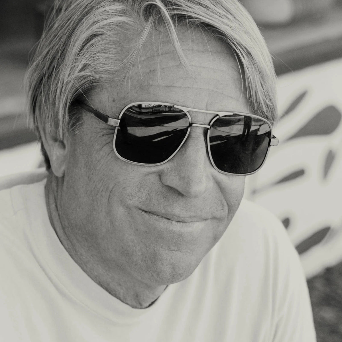 Front view of CADDIS - METAMODERNIST SCOUT SUNGLASSES by CADDIS, featuring an aviator-style sleek metal alloy frame and dark green premium tinted lenses, displayed on a white background.