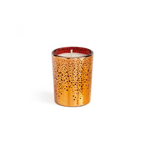 The LAFCO Absinthe Plum Holiday Votive, a 1.90oz soy wax candle, is elegantly showcased in a glass holder with small black dots and a red lining inside, set against a plain white backdrop. The subtle aroma of black plum enhances its sophisticated design.