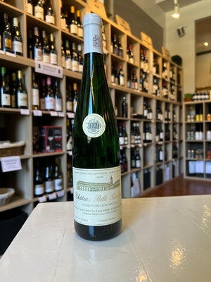 A tall green glass wine bottle with a silver cap features a label reading "CHÂTEAU BELÁ RIESLING 2020." This WINE: KELLOGG SELECTIONS bottle, from Slovakia’s Danube region, displays a gold award sticker against a plain white background.