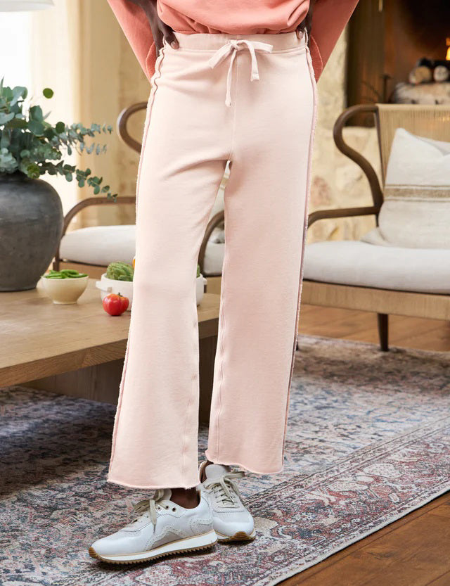 The FRANK &amp; EILEEN BELLA ITALIAN SWEATPANT is a light beige, wide-leg knit pant with a drawstring waist and subtle side trim, shown flat on a white background.