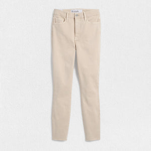 The FRANK & EILEEN SLIGO SKINNY JEAN is a pair of beige, high-waisted skinny jeans crafted from sustainable Italian Performance Denim. They feature a high-rise contour waistband, five pockets, button and zip closure, and a "Frank" label on the waistband. The jeans are displayed against a white textured background.