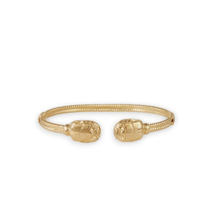 Explore the exquisite Duality Large Scaramouche Twist Bracelet by GAS BIJOUX. This gold-plated bracelet features two detailed scarab designs at its open ends and an adjustable, textured surface, providing a sophisticated look ideal for enthusiasts of beetle-themed jewelry.