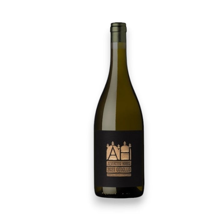 A bottle of ALVAREDOS HOBBS GODELLO 2020 by WINEBOW stands upright against a white background, with a dark label featuring two wine barrels, trees above them, and origin details from Ribeira Sacra.