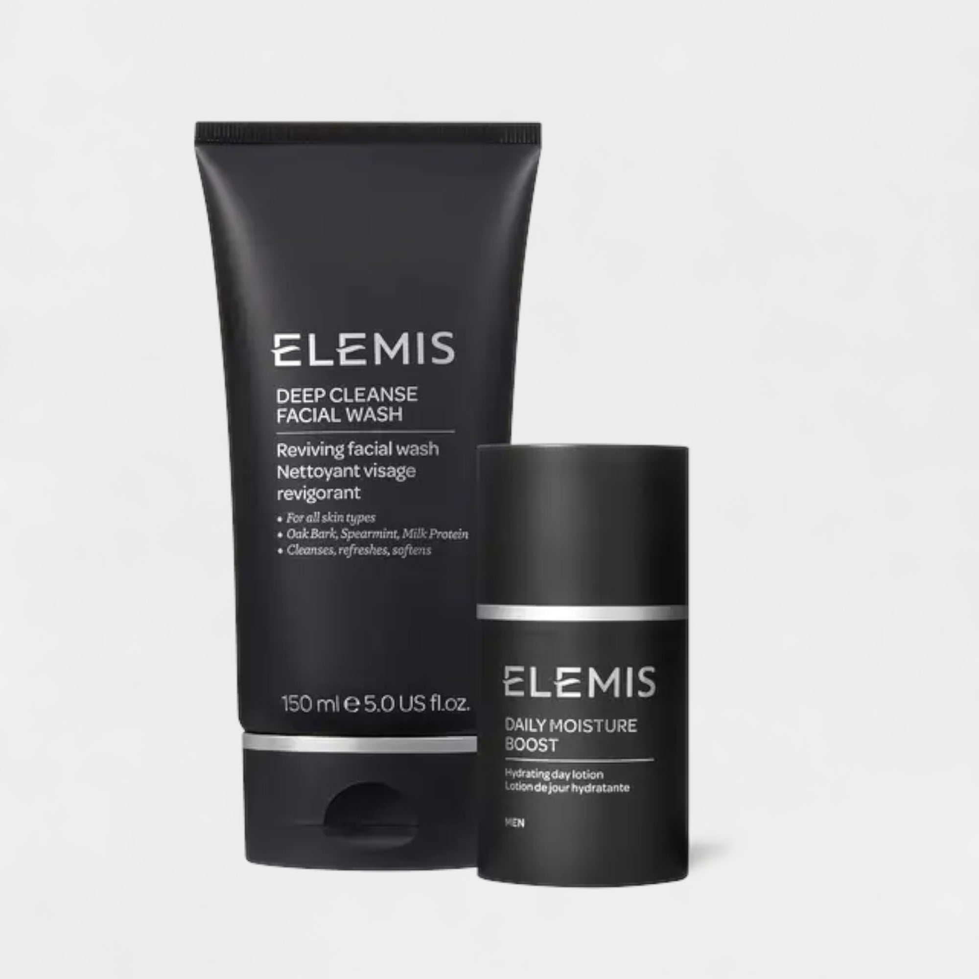 The ELEMIS - THE ESSENTIAL MEN'S DUO KIT, by ELEMIS - STEINER, comes in a boxed set with a teal and green patterned design. This kit features two Elemis skincare products prominently displayed on the package: a black tube labeled "Deep Cleanse Facial Wash" and a black bottle labeled "Daily Moisture Boost.