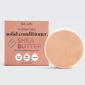 The image showcases a SHEA BUTTER CONDITIONER BAR from the brand KITSCH. The packaging, labeled "Hydrating Solid Conditioner Shea Butter," highlights its color-safe, pH balanced, and vegan properties. Perfect for frizz control, this plastic-free conditioner sits neatly on top of the box.