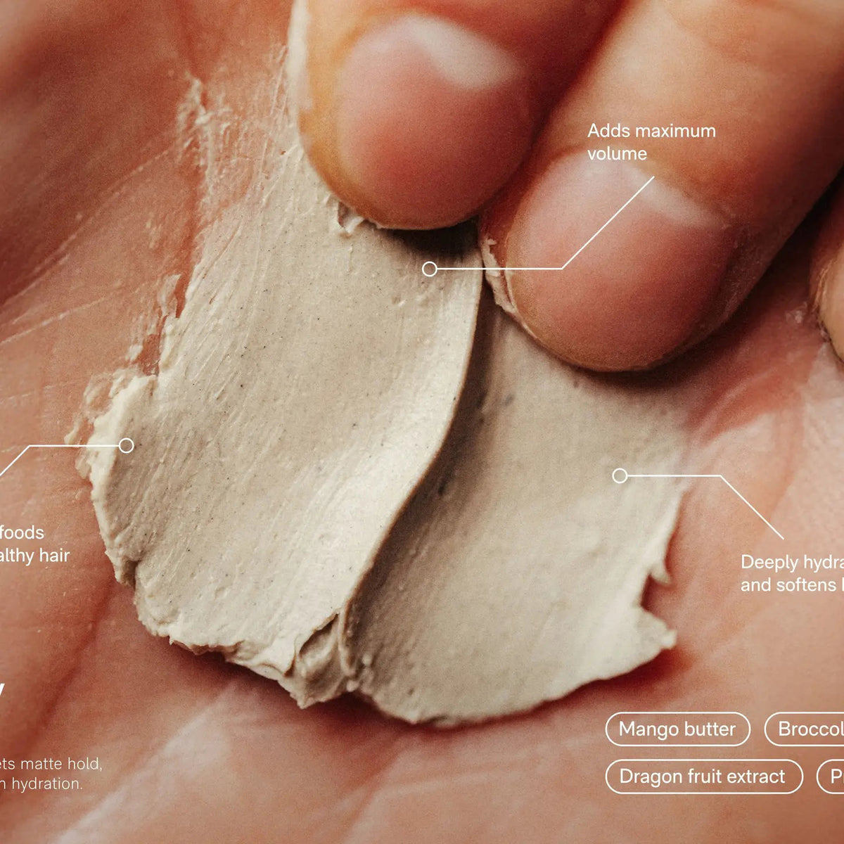 A round black container labeled &quot;JACK HENRY - HAIR PUTTY&quot; features white text promoting hydrating, volumizing benefits with medium hold and a matte finish. The Jack Henry container casts a shadow on a white background.