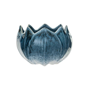 The FLOWER SHAPED PLANTER from CREATIVE COOP is a ceramic bowl with a wavy, scalloped edge, featuring a reactive glaze in various shades of blue and white.