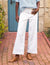 The FRANK AND EILEEN - WEXFORD WIDE LEG LINEN TROUSER IN WHITE from FRANK & EILEEN is a stylish pair of wide-leg pants made from lightweight Italian Performance Linen. These white trousers feature a mid-rise waist, a concealed front zipper, and side pockets, all with a straight and relaxed fit that extends to the hem.