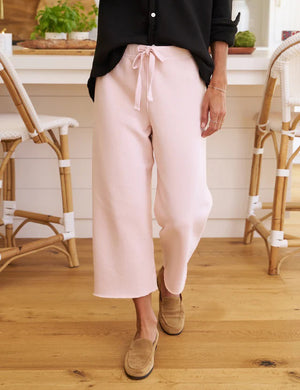 Introducing the CATHERINE FAVORITE SWEATPANT from FRANK & EILEEN in a stunning vintage rose hue. These loose-fitting, cropped, wide-leg sweats come with an elastic waistband and drawstring for optimal comfort. Crafted from soft, lightweight fabric and showcased against a white textured background, they're the perfect blend of comfort and style.