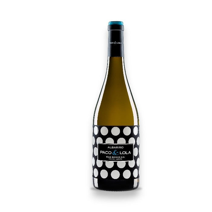 A bottle of WINE: GRAPEVINE PACO &amp; LOLA ALBARINO 2023, with a bold black label and white polka dots on a plain white background, offers refreshing citrus and lychee notes in its flavor profile.