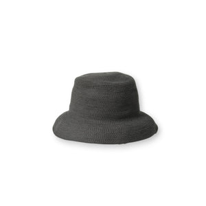 The BEACH HARE - WANDER HAT, a light-colored, wide-brimmed straw hat handmade by BEACH HARE in NYC, is showcased on a white background. It features a slightly curved brim and a simple woven pattern that exudes a casual and summery look. Additionally, it's packable for easy travel.