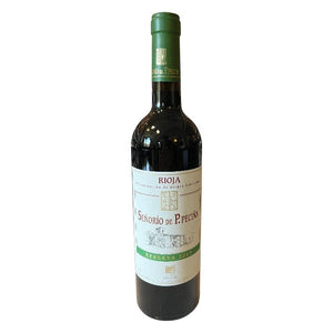 A bottle of PECINA RIOJA RESERVA 2017 by WINE: ADVINTAGE with a cream and green vineyard-illustrated label, shown on a plain white background.